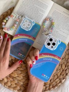 قاب موبایل آیفون آسمان آبی و رنگین کمان هلوگرامی + آویز خرسی - تصویر 3