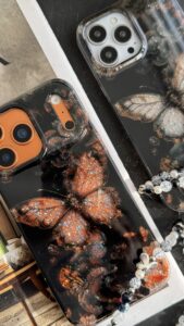 قاب موبایل آیفون پروانه ترنسپرنت مشکی پولکی طلایی - تصویر 2