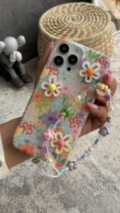 قاب موبایل ( آیفون ) گل بابونه رنگی رنگی برجسته + بندست