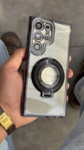 قاب موبایل ( آیفون - سامسونگ ) کلاسیک دور نگین طرح مگسیفیت استندشو - تصویر 3