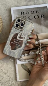 قاب موبایل آیفون قلب رمانتیک آیینه ای نگین دار + بندست