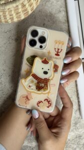 قاب موبایل آیفون کندل کریسمس سگ پاپی + پاپسوکت متحرک